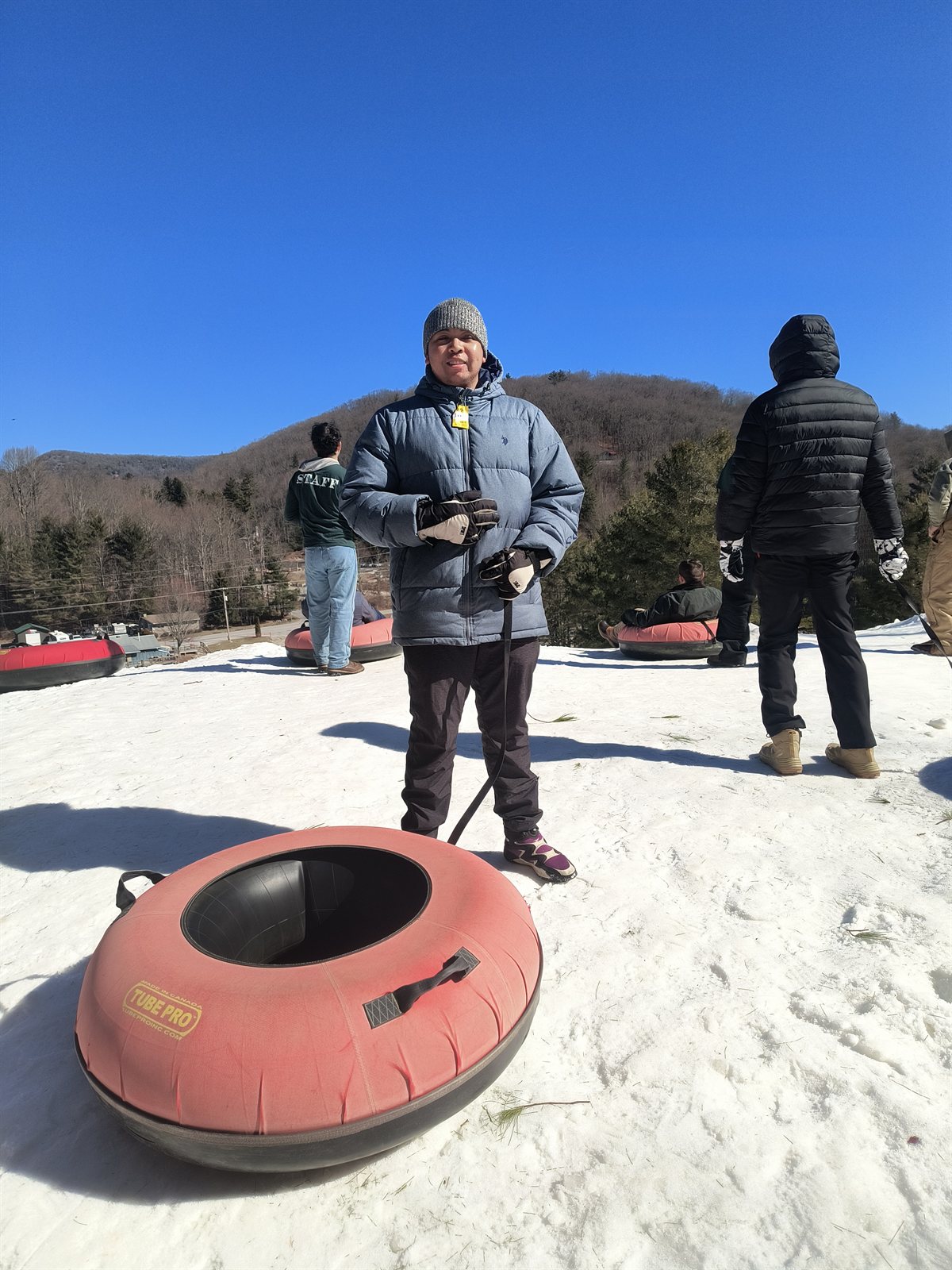 Ready for snow tubing on a sunny winter day